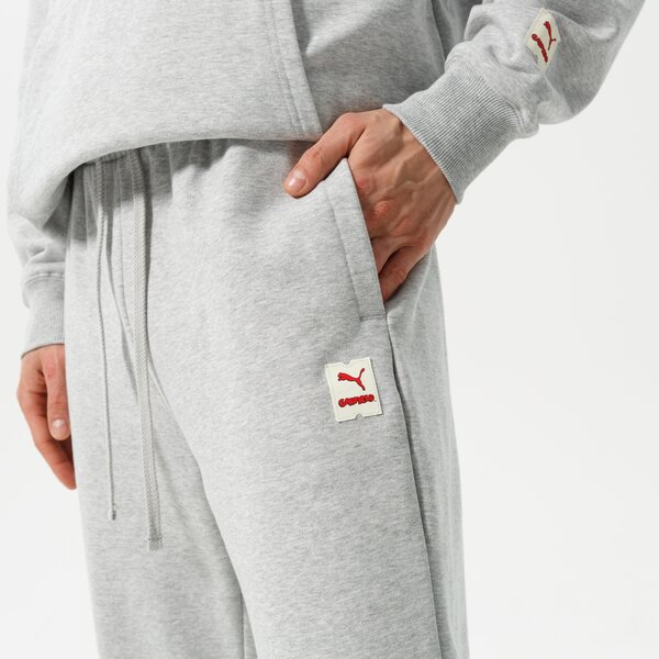 Vīriešu bikses PUMA BIKSES PUMA X GARFIELD SWEATPANTS 534436 04 krāsa pelēka