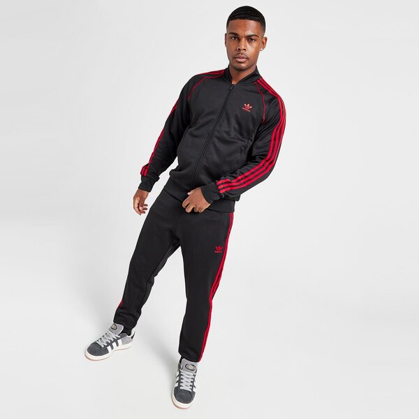 Vīriešu džemperis ADIDAS DŽEMPERIS AR RĀVĒJSLĒDZĒJU    SSTAR TT BLK/RED it7144 krāsa melna