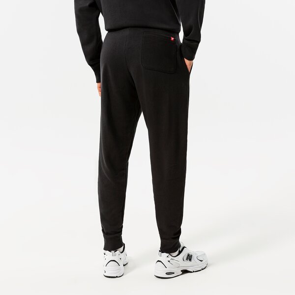 Vīriešu bikses NEW BALANCE BIKSES NB ESSENTIALS STACKED LOGO SWEATPANT mp03558bk krāsa melna